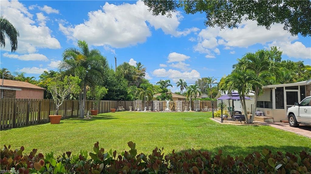Lot looking front to back. House and driveway are on the lot next door - 865 103rd Ave N.