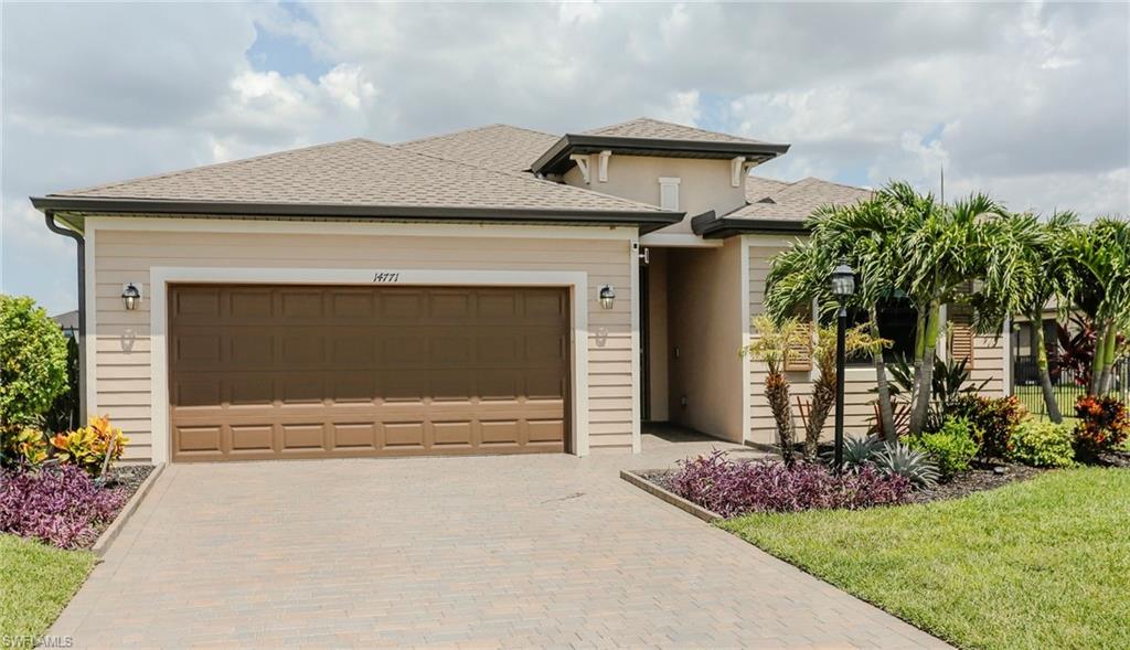 Exterior featuring a hip roof, horizontal siding, and stucco accents