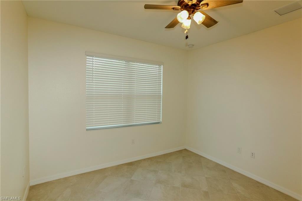 Recessed lighting, ceiling fan with integrated lighting, window with blinds, and tile flooring
