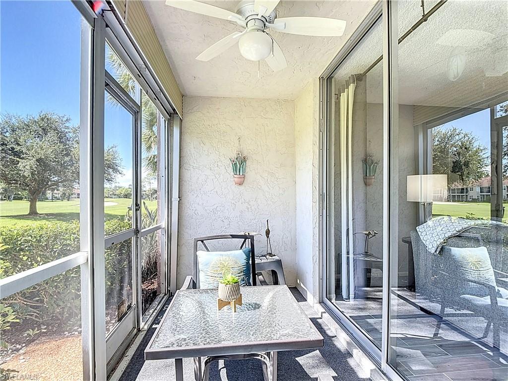 Sunroom / solarium featuring a ceiling fan