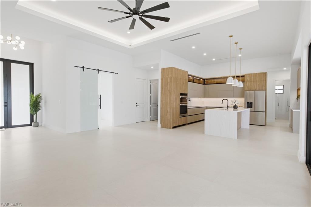 Large-format tile flooring and contemporary finishes create a clean, sophisticated atmosphere.