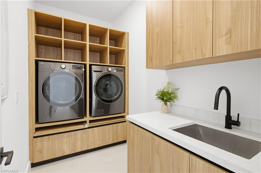 Additional features include stylish laundry room w/ custom cabinetry, utility sink, washer & dryer, designer lighting throughout, modern interior doors, floating vanities, upscale plumbing fixtures, custom built-in closet systems, extensive storage & meticulous attention to detail in every room