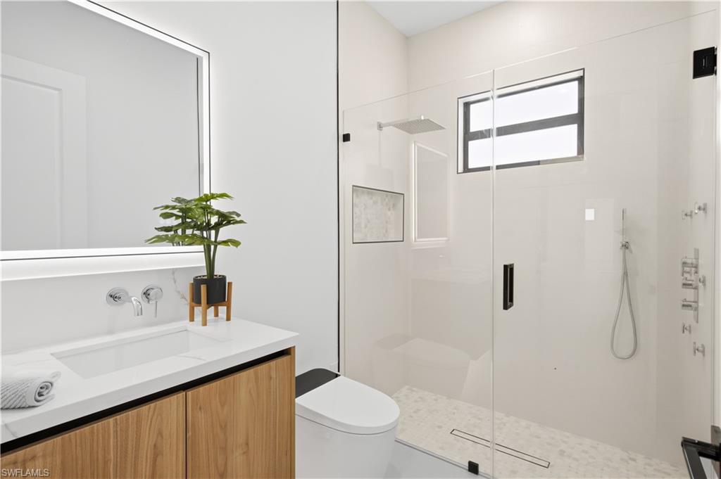 Convenient hallway bathroom features modern finishes and a clean contemporary design.