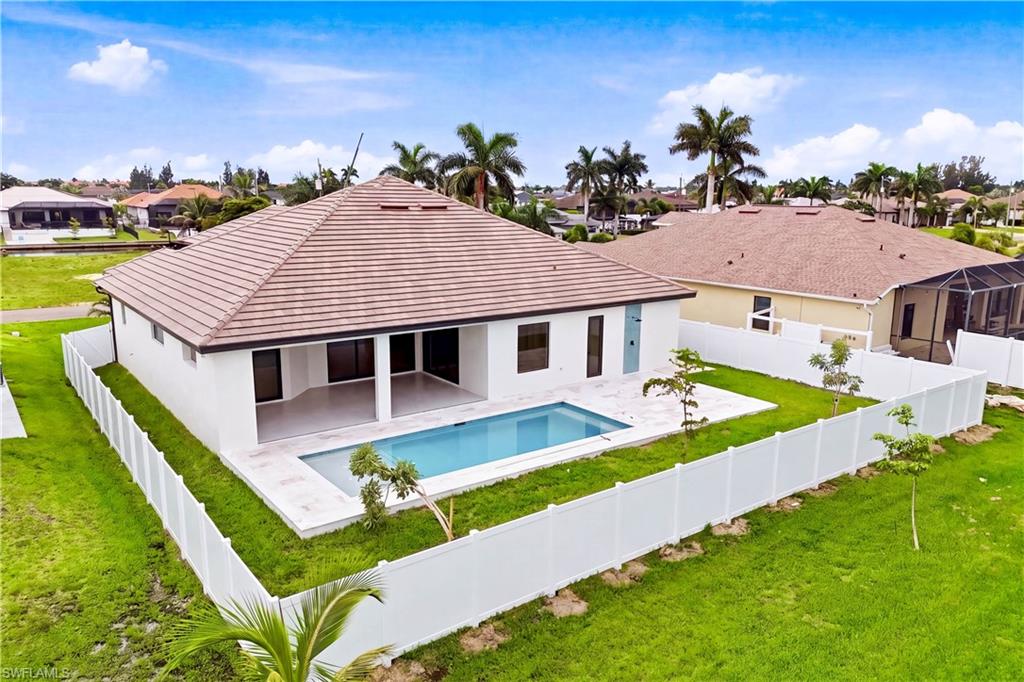 Fully fenced backyard offers privacy, a sparkling pool and generous space for outdoor enjoyment.
