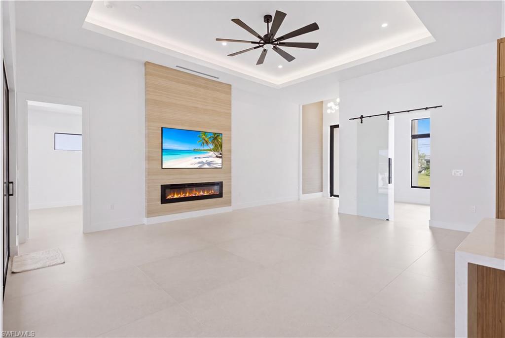 Designer feature wall with sleek linear fireplace creates a striking focal point.