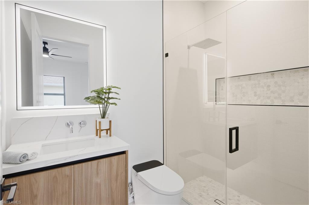 Private ensuite bathroom adds comfort and convenience to the second primary suite.