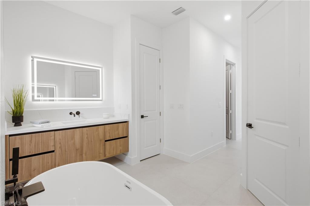 Designer tile, sleek fixtures and contemporary finishes create a luxurious private retreat.