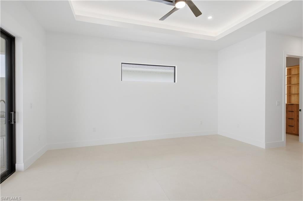 Private primary bedroom features direct access to custom-designed walk-in closets.