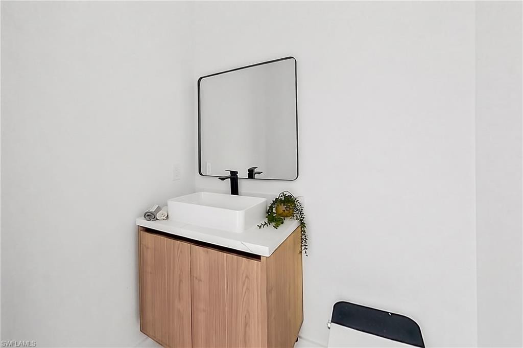 Outdoor shower and cabana pool bathroom adds convenience after enjoying the Florida sunshine!