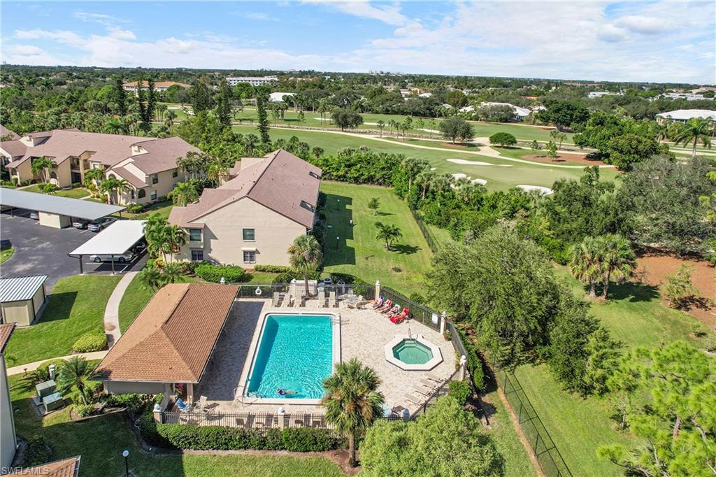 Bird's eye view of a pool and a tree filled landscape