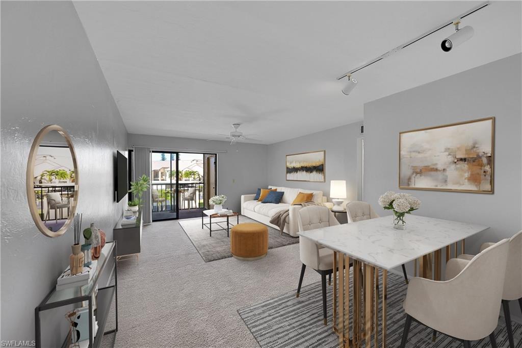 Virtually staged LR and dining featuring rail lighting and ceiling fan