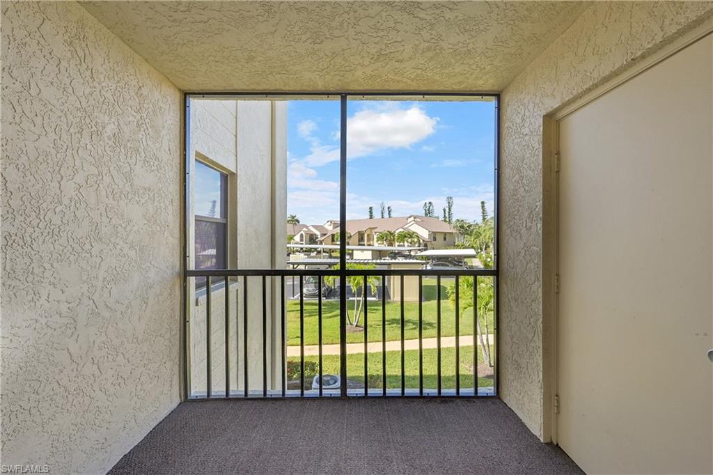 Balcony with a sunroom and a residential view