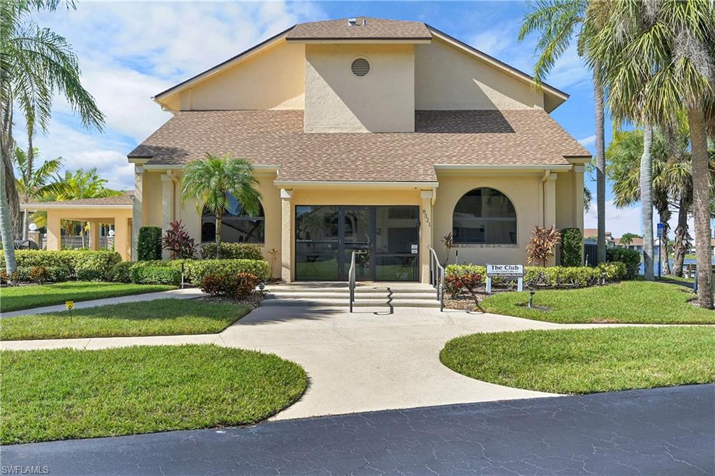 View of property with curved driveway