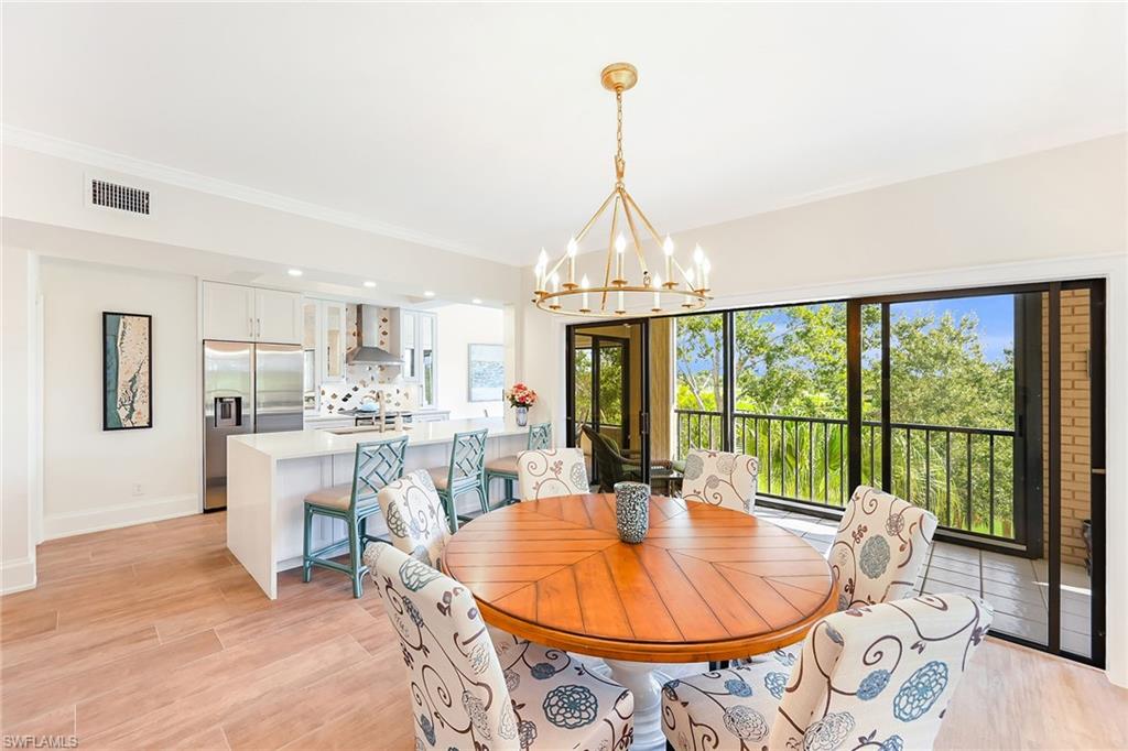 Dining area open to kitchen and screened patio