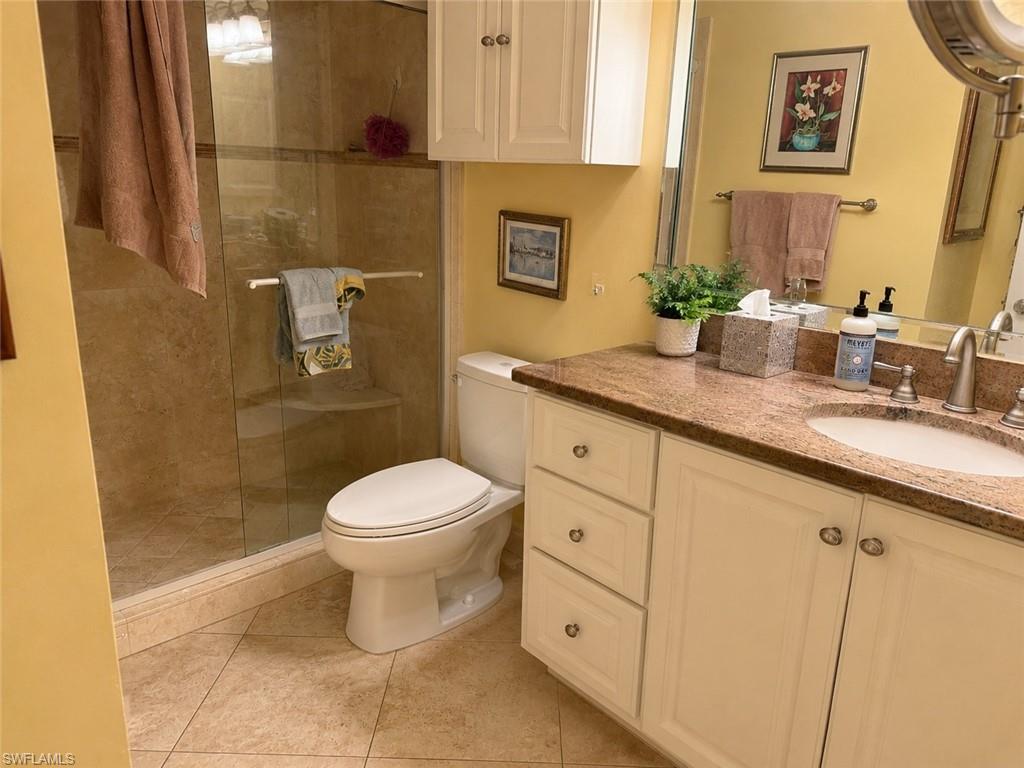 *Enhanced photo Shower with clear glass enclosure and integrated bench seating