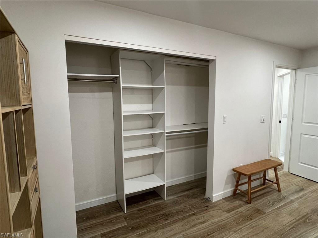 Built-in closet system featuring shelving and hanging rods