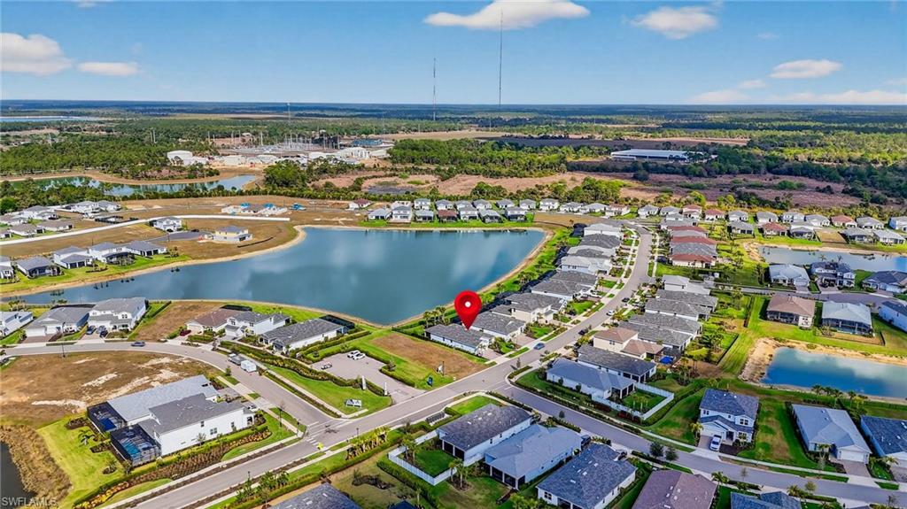 Aerial perspective of a developed residential community with multiple single-story residences