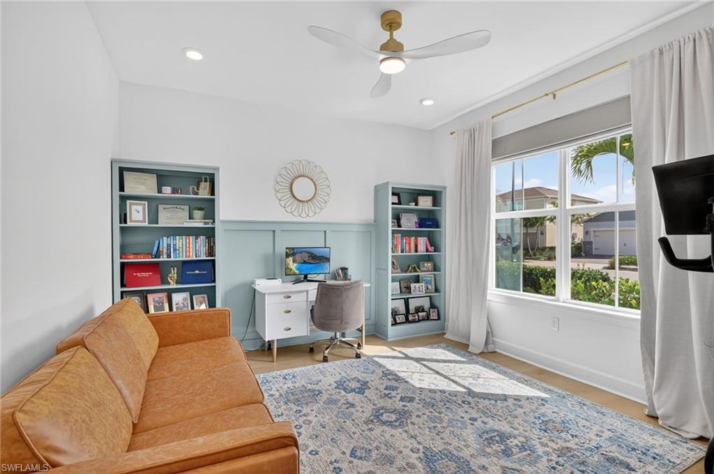 Spacious room featuring light wood-finish flooring and a multi-pane window