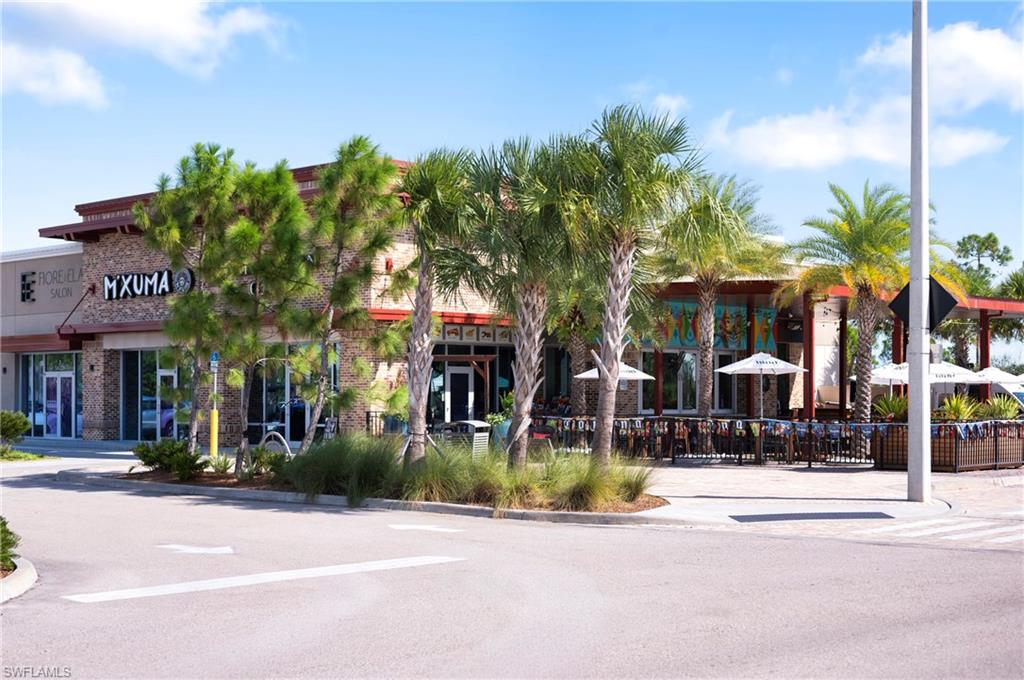Commercial building featuring stone and stucco exterior finishes