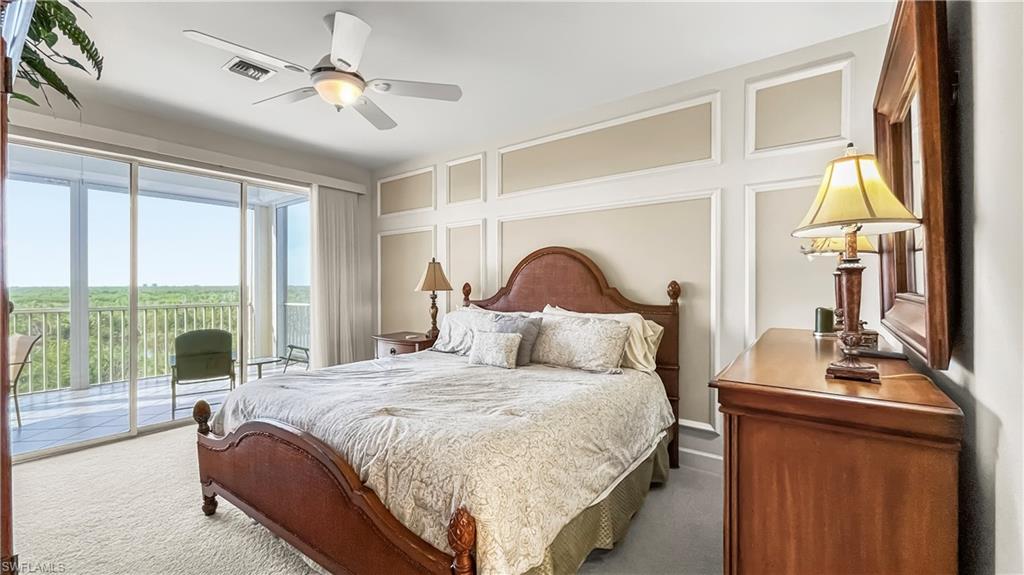 Bedroom with carpet, ceiling fan, and access to outside