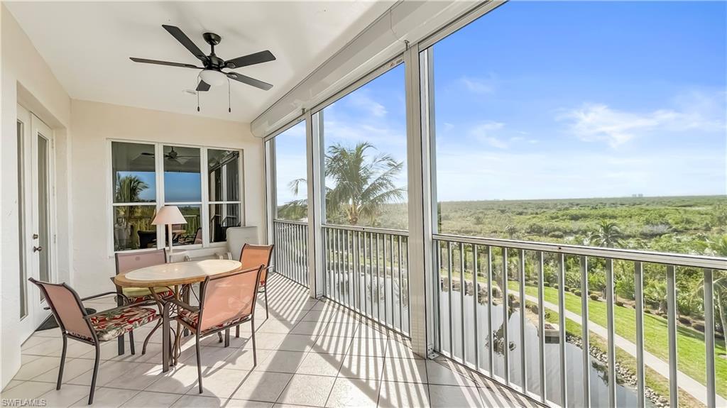 Sunroom featuring ceiling fan