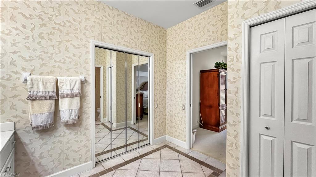 Bathroom with tile patterned flooring and vanity
