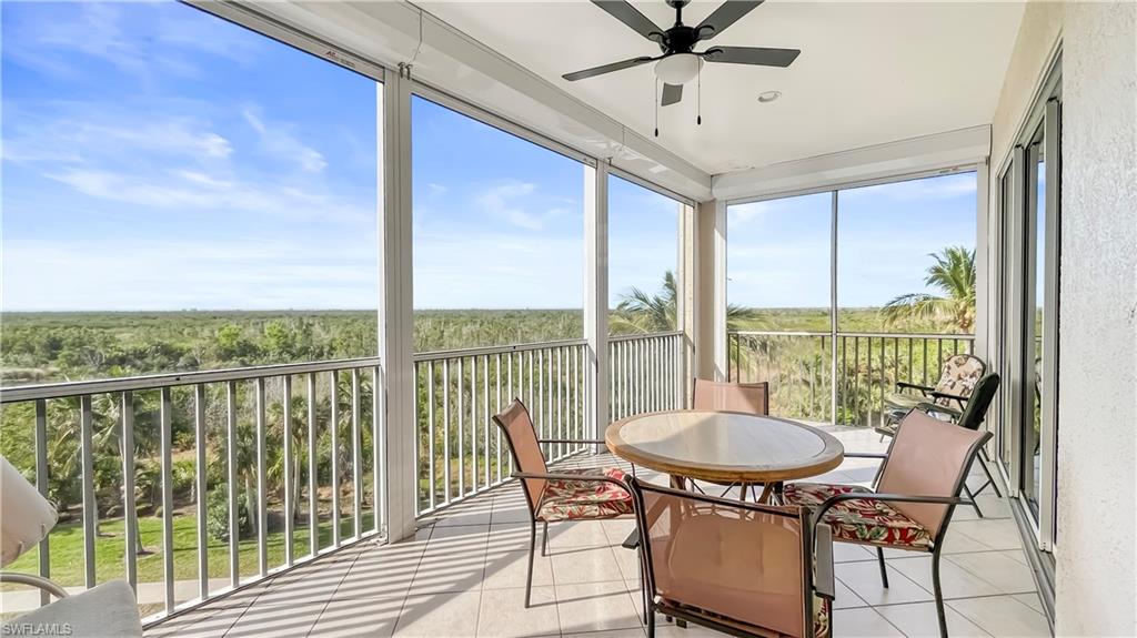 Sunroom / solarium with plenty of natural light and ceiling fan