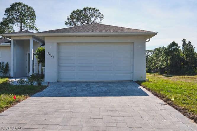 Garage with decorative driveway