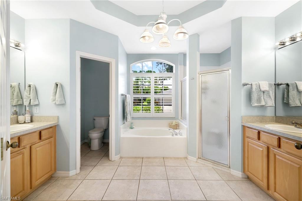Primary Bathroom with Separate Vanities, Walk in Shower and Garden Tub