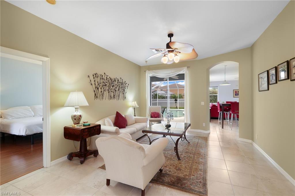 View from Dining Area to Living Room, Sliders to Pool and Breakfast Nook to Family Room and Kitchen