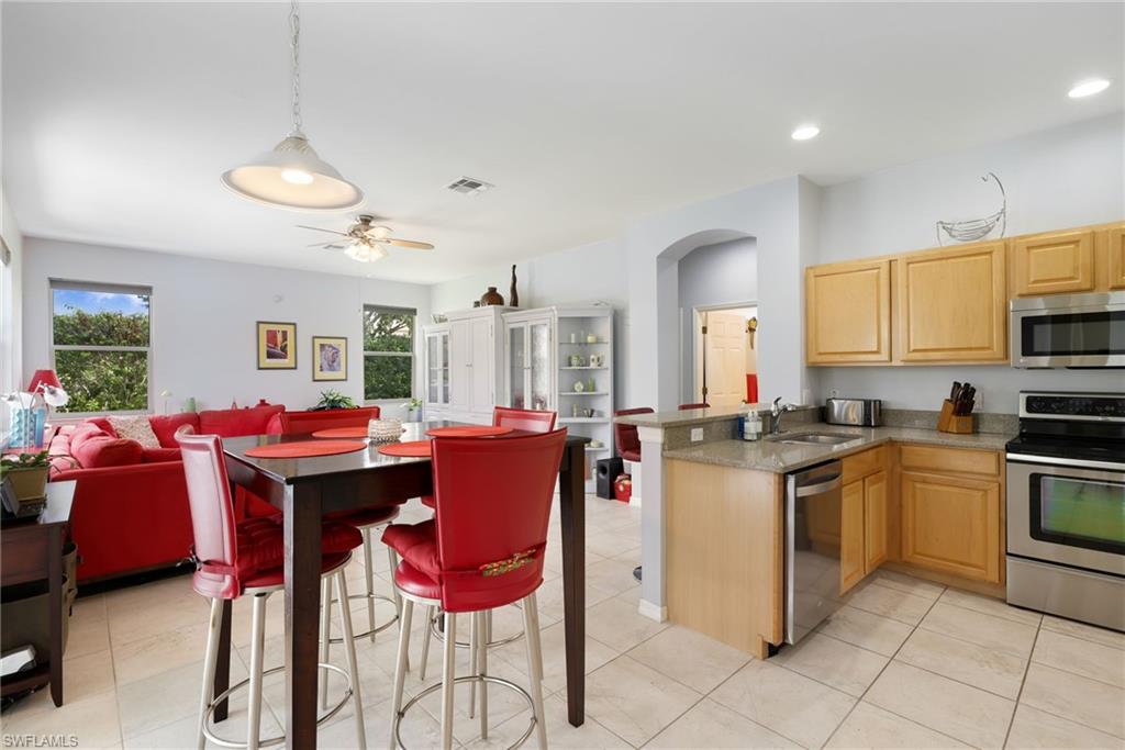 Kitchen and Breakfast Nook with Sliders to Pool