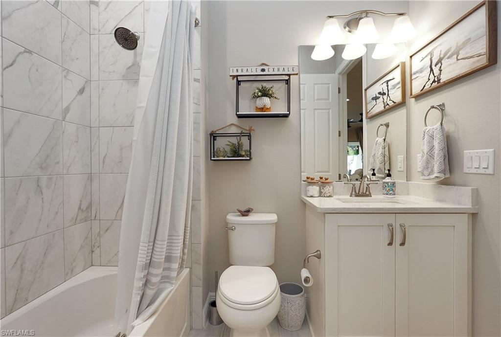 guest bath that has dual entry from kitchen and guest room