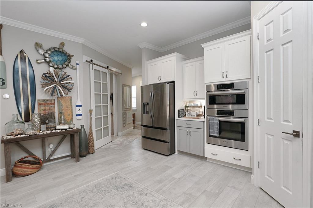Kitchen off front entry and laundry room that leads to garage
