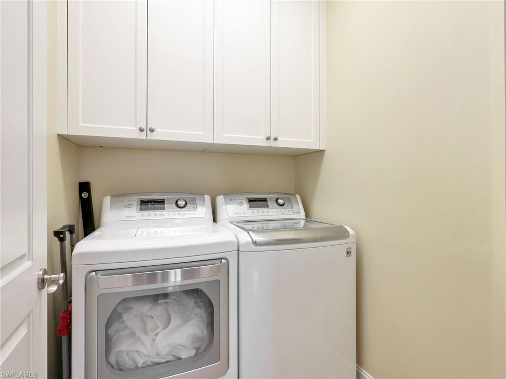 In house laundry with cabinet storage