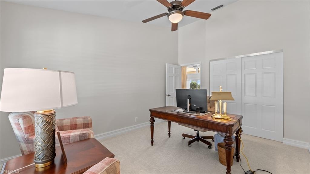 Could be 4th Bedroom, Office or Den, Vaulted  ceiling room with light-toned wall paint and neutral carpeting-- with closet for a 4th bedroom