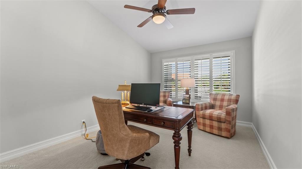 Office or 4th Bedroom, Vaulted ceiling with a ceiling fan, window with plantation shutters, light gray wall color, and white baseboards