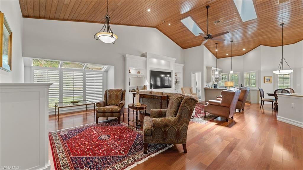 Vaulted wood-paneled ceilings with skylights
