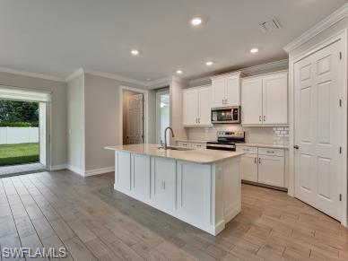 OPENM KITCHEN WITH ISLAND SINK PREP AREA
