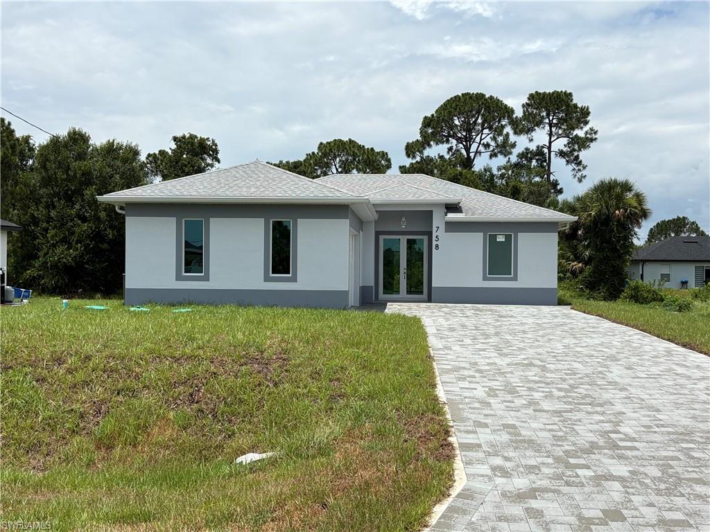 Single-story residence featuring a light gray exterior with darker gray trim