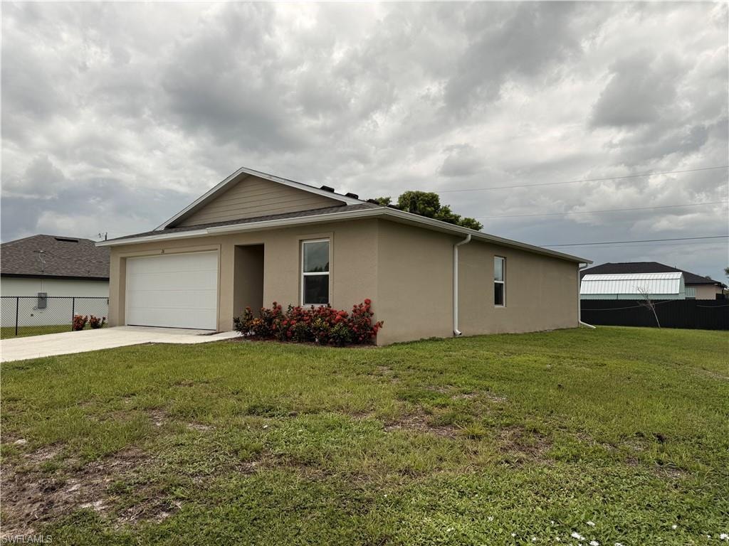 Stucco exterior with a single-car garage and concrete driveway