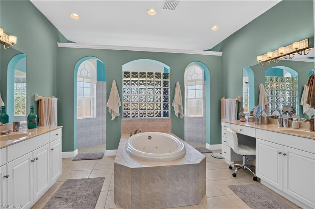 Master bath with many custom features. Twin vanities.