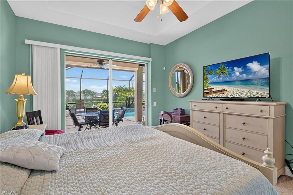 Master suite with view of pool and canal