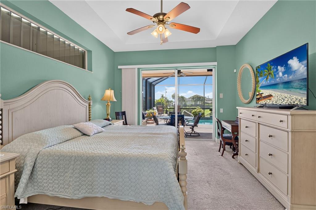 Master suite with view of pool and canal