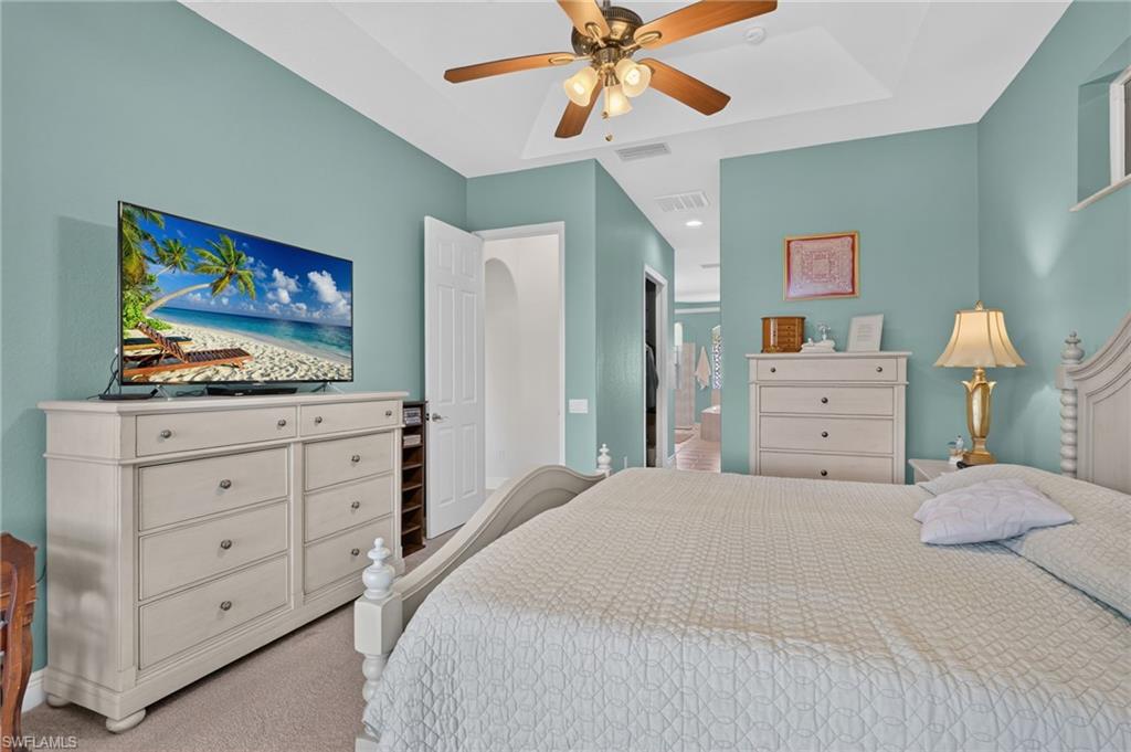 Master suite with opening to closets and luxurious bathroom features