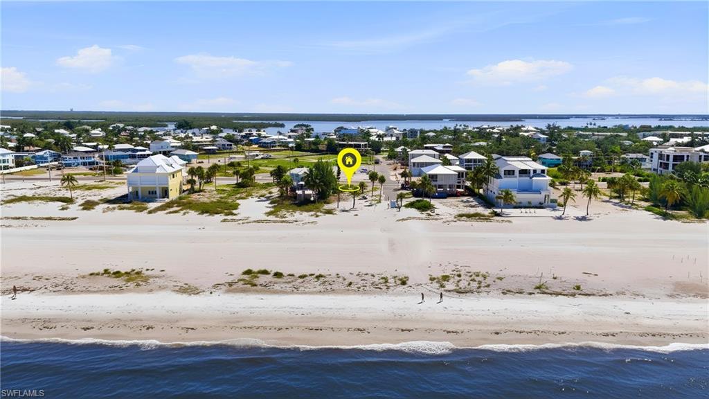 Beachfront property featuring a white sand beach