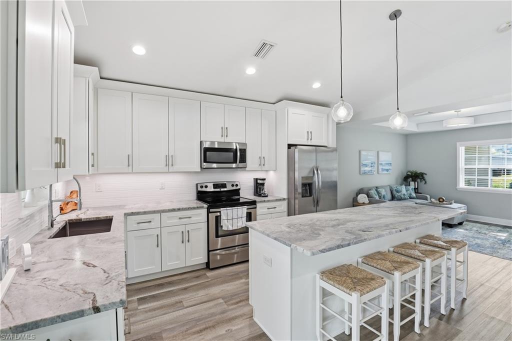 Kitchen with beautiful granite, under cabinet lighting, and more!