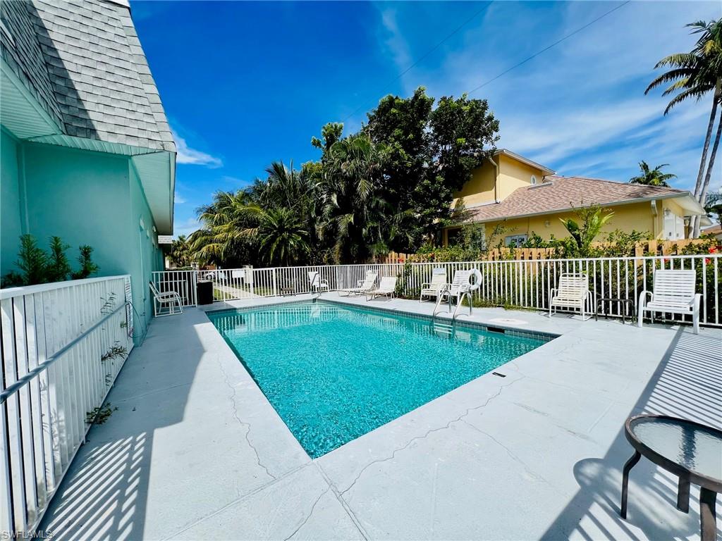 Rectangular swimming pool featuring a light blue finish