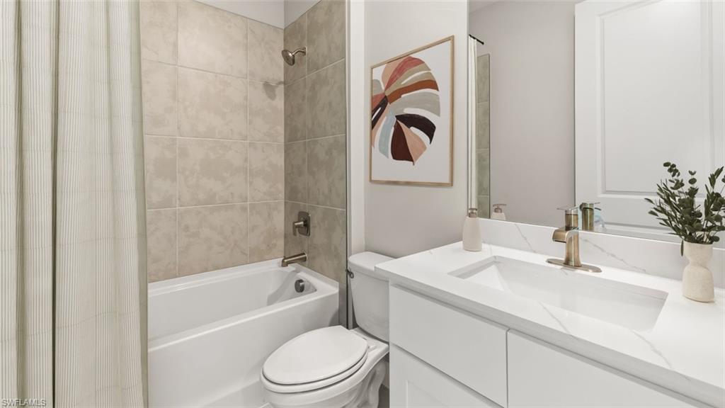 Integrated bathtub with tiled shower surround and brushed nickel fixtures