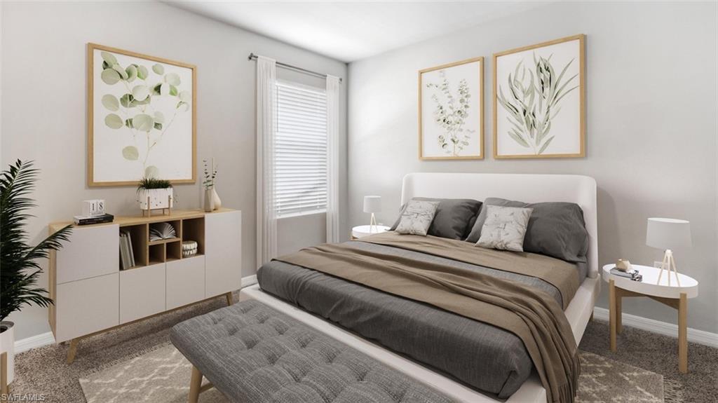 Carpeted bedroom with a large window featuring horizontal blinds