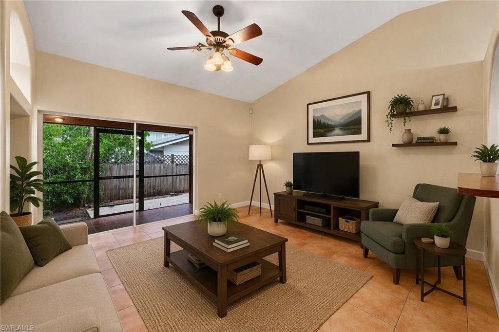 Living area with vaulted ceilings and ceramic tile flooring